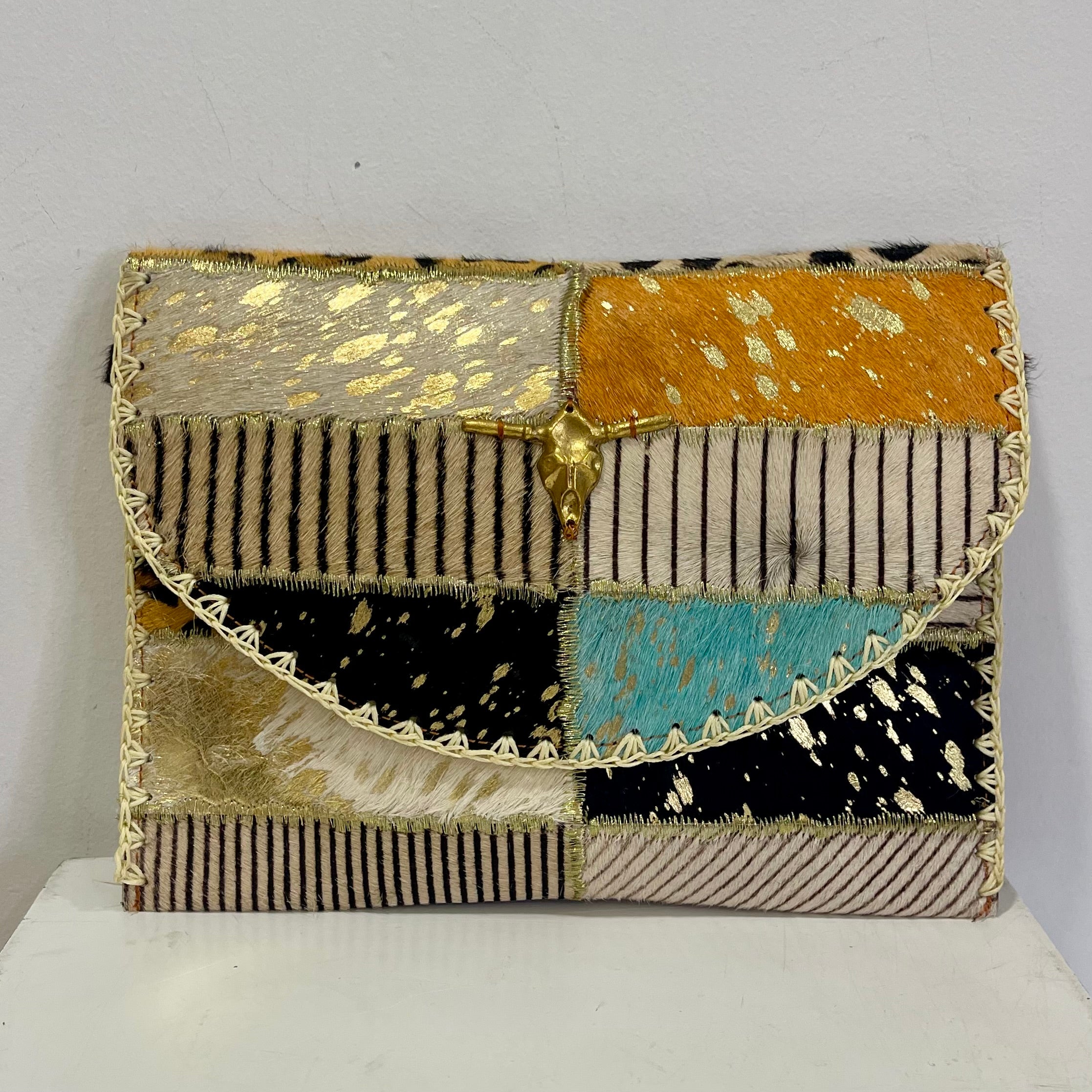 Pochette PATCHWORK orange en cuir de vachette avec bandoulière